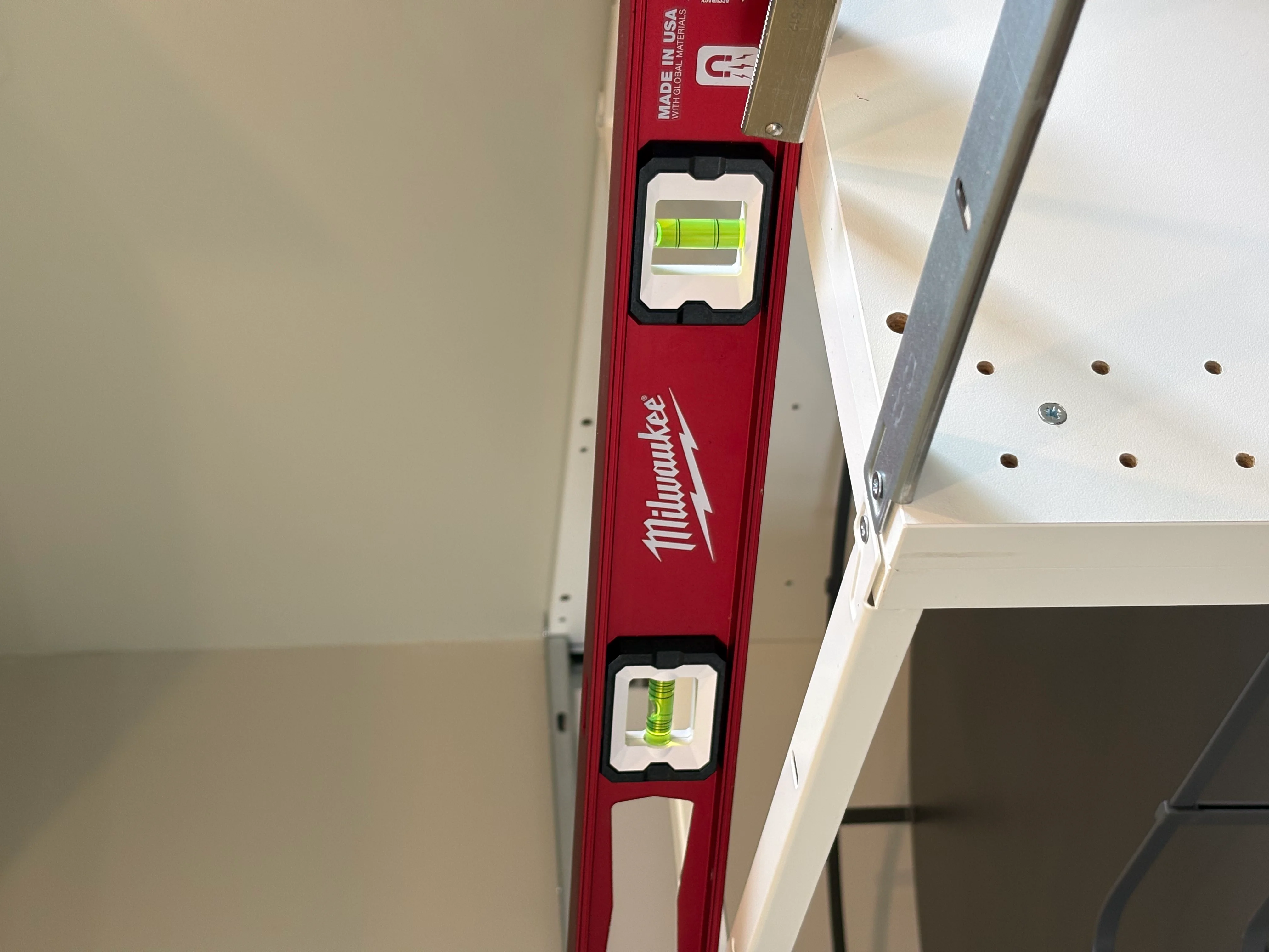 Cabinet frame being checked with a level